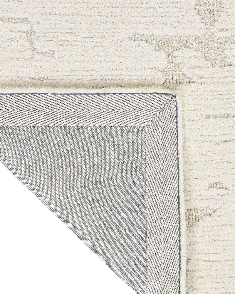 CALVIN KLEIN SCULPTURAL IVORY CUT & LOOP WOOL RUG
