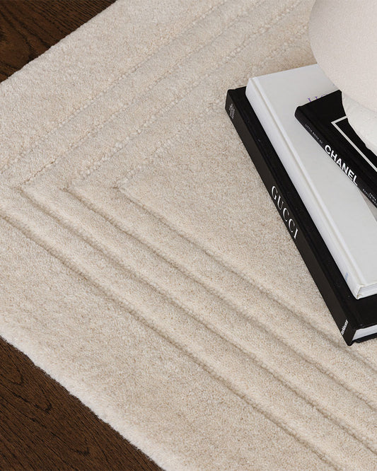 ORLO IVORY UNDYED WOOL BORDERED RUG