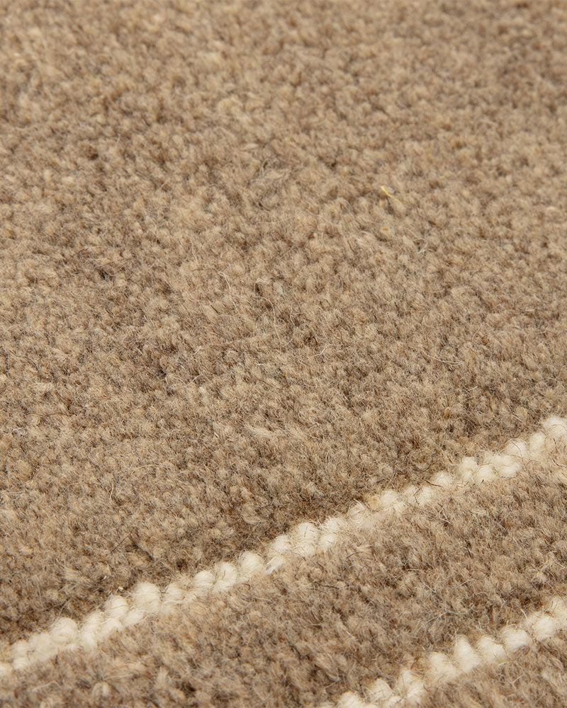 ORLO BEIGE NATURAL UNDYED WOOL BORDERED RUG