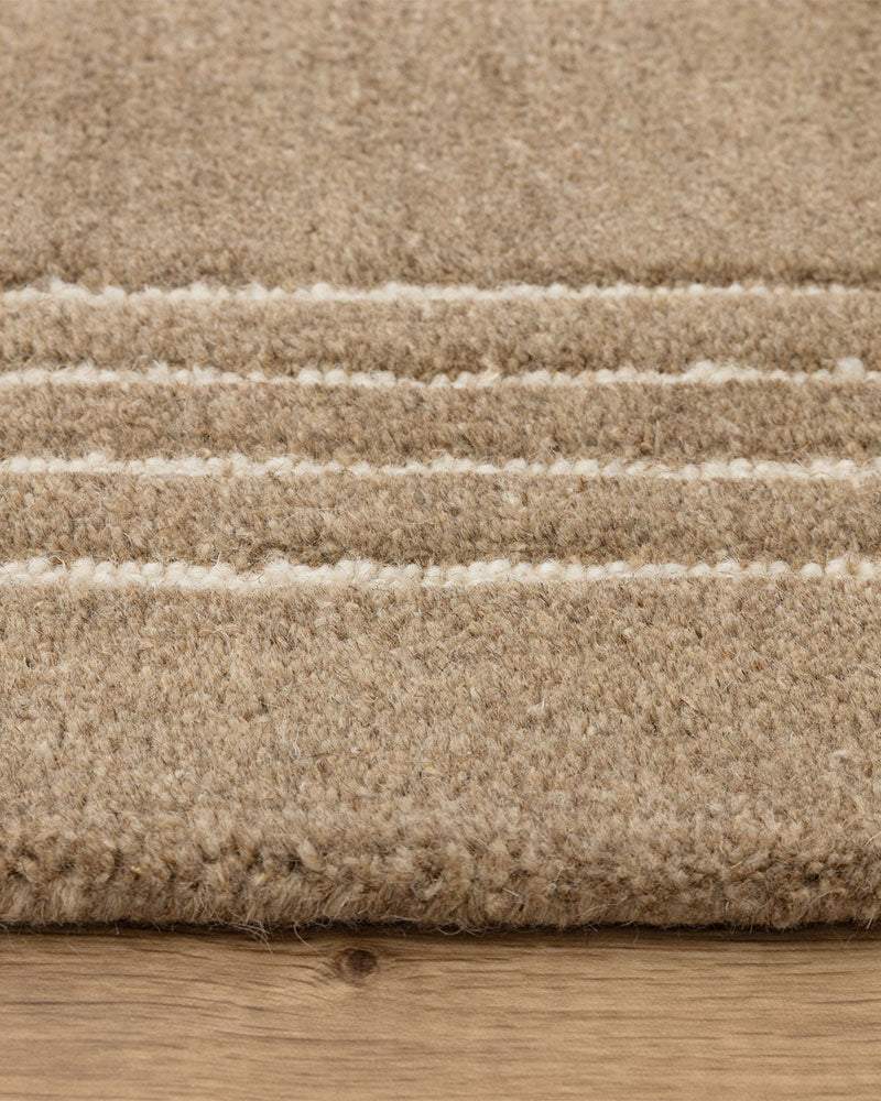 ORLO BEIGE NATURAL UNDYED WOOL BORDERED RUG