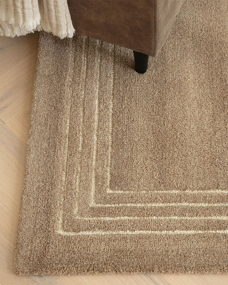 ORLO BEIGE NATURAL UNDYED WOOL BORDERED RUG