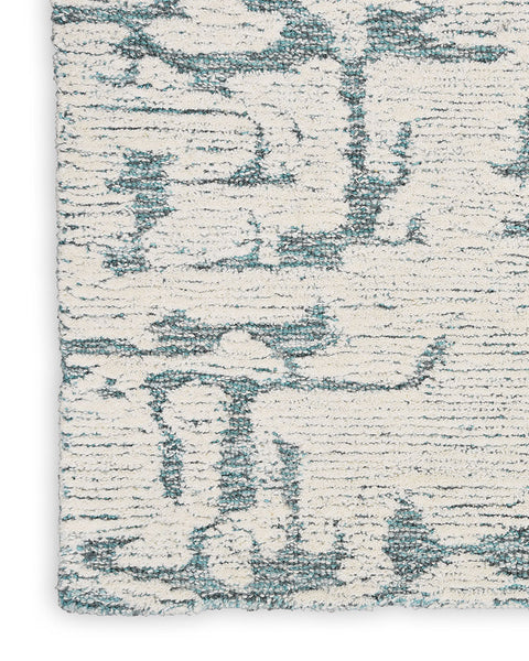 CALVIN KLEIN SCULPTURAL TEAL CUT & LOOP WOOL RUG